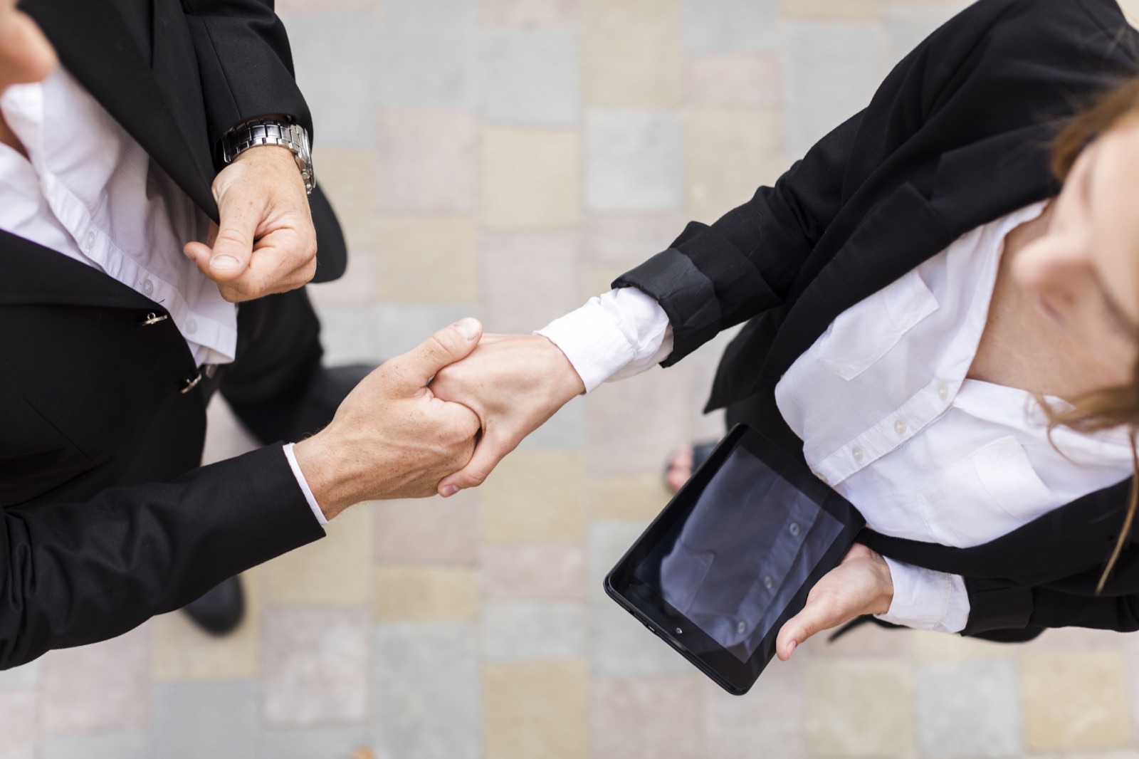 Image showing two business people shaking hands at the business matchmaking event